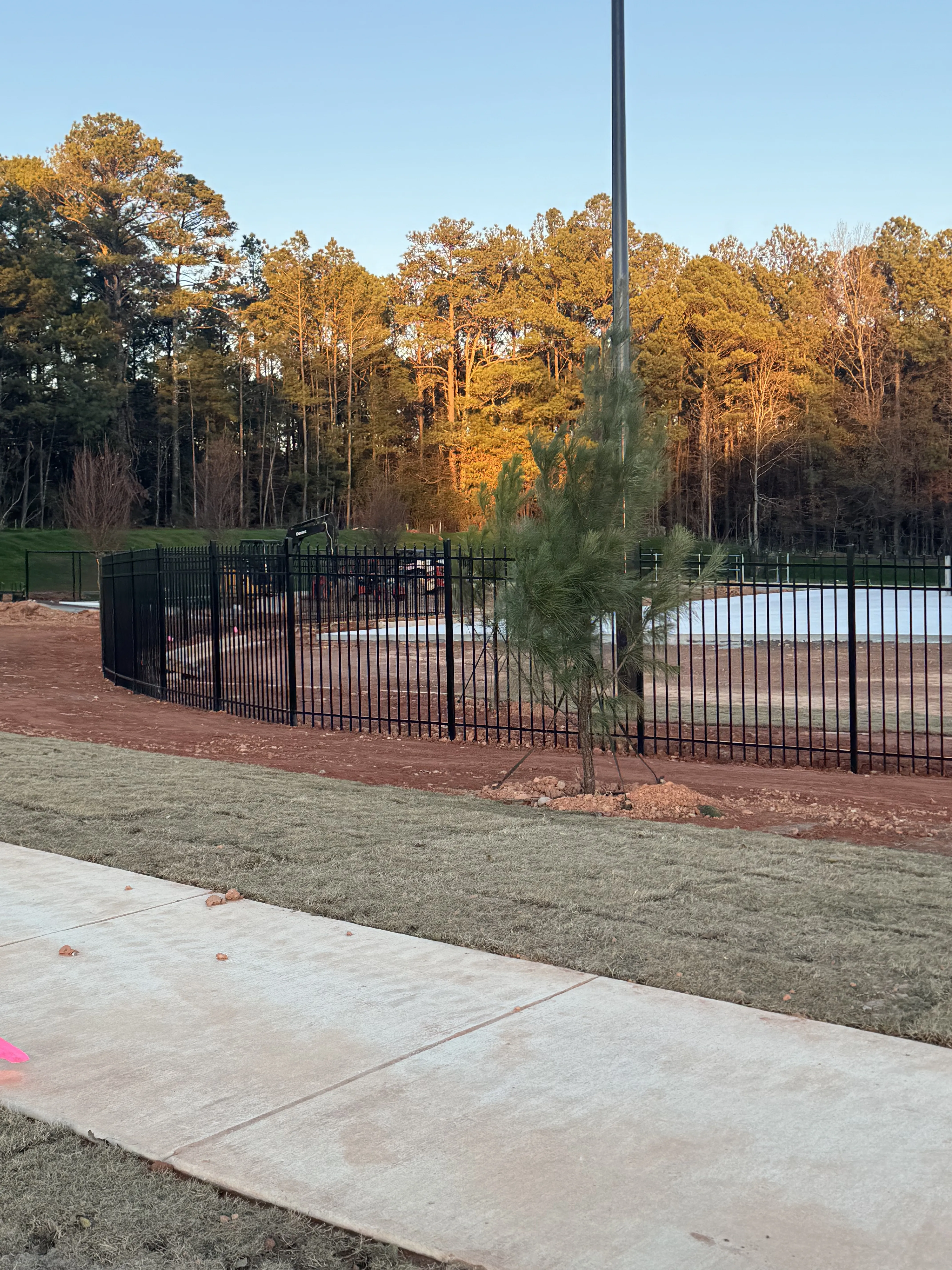 Iron fence along autumn property