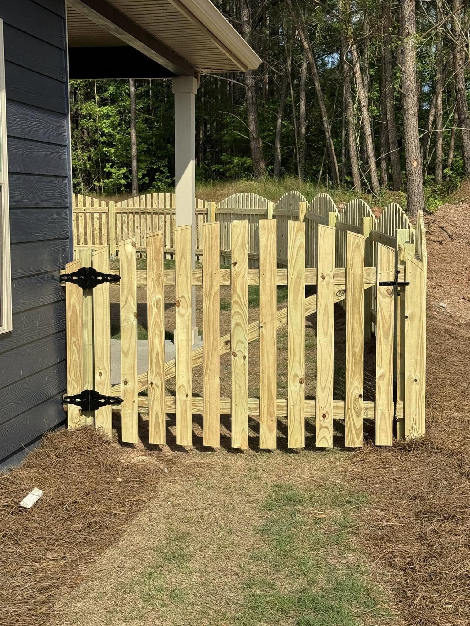 Wood arched picket gate