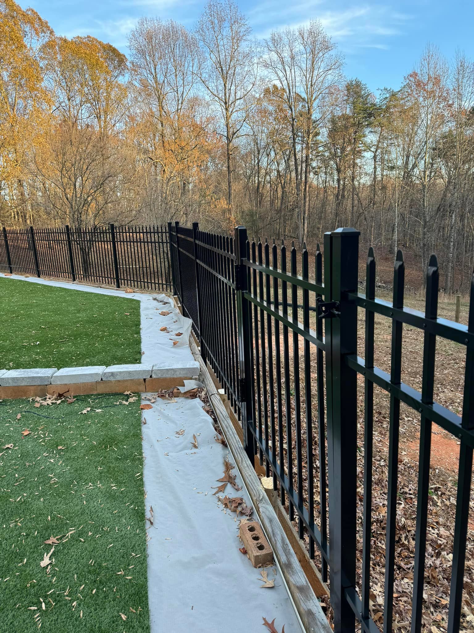Ornamental iron fence with spear tops