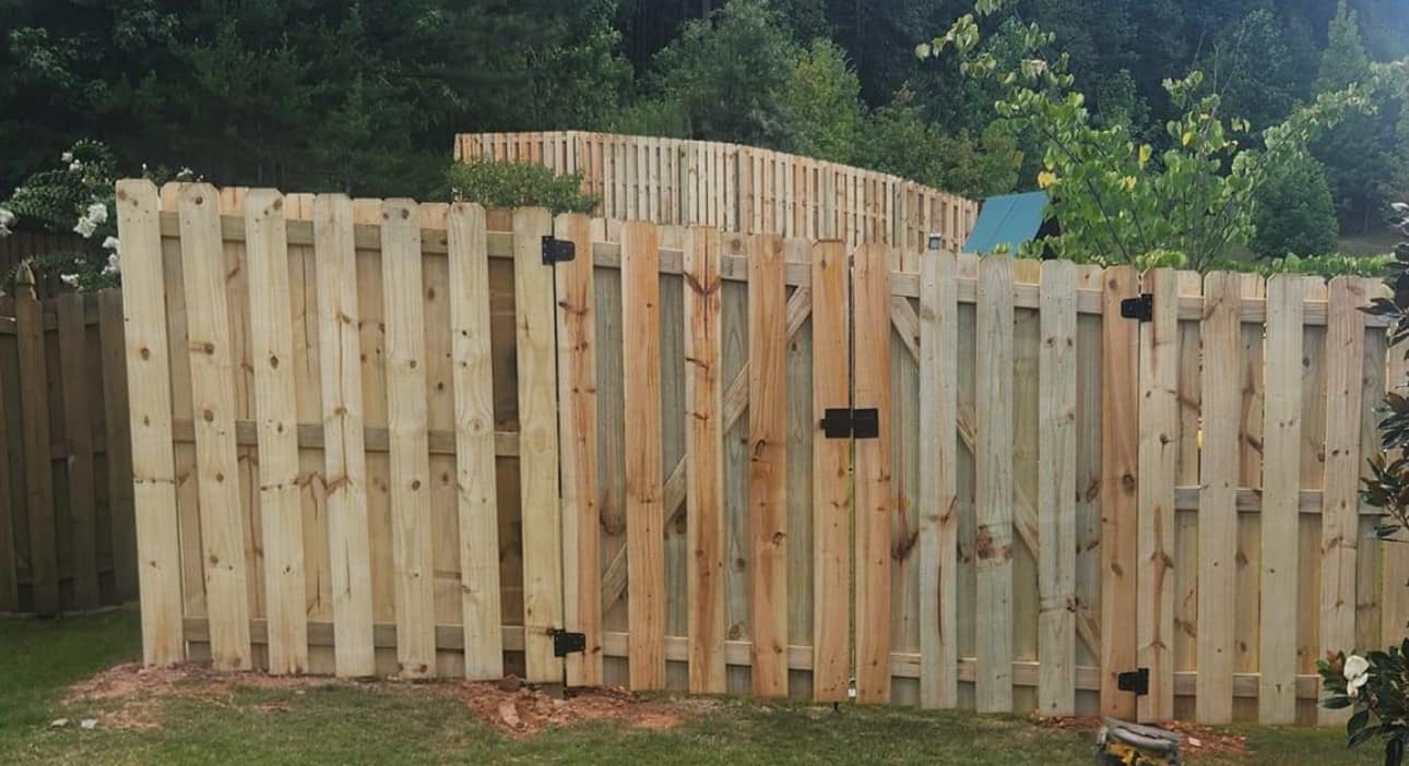 Shadow box fence with arched double gate