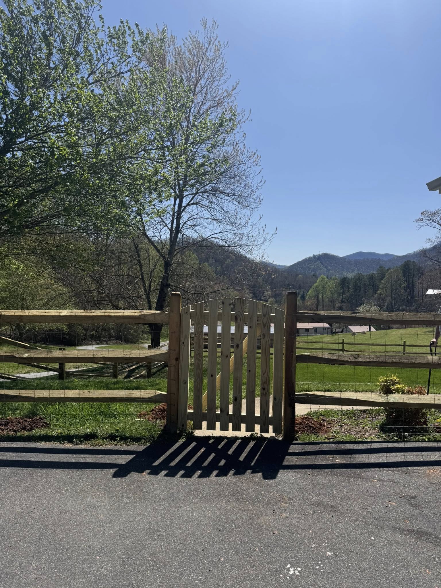 Split rail fence with mountain backdrop