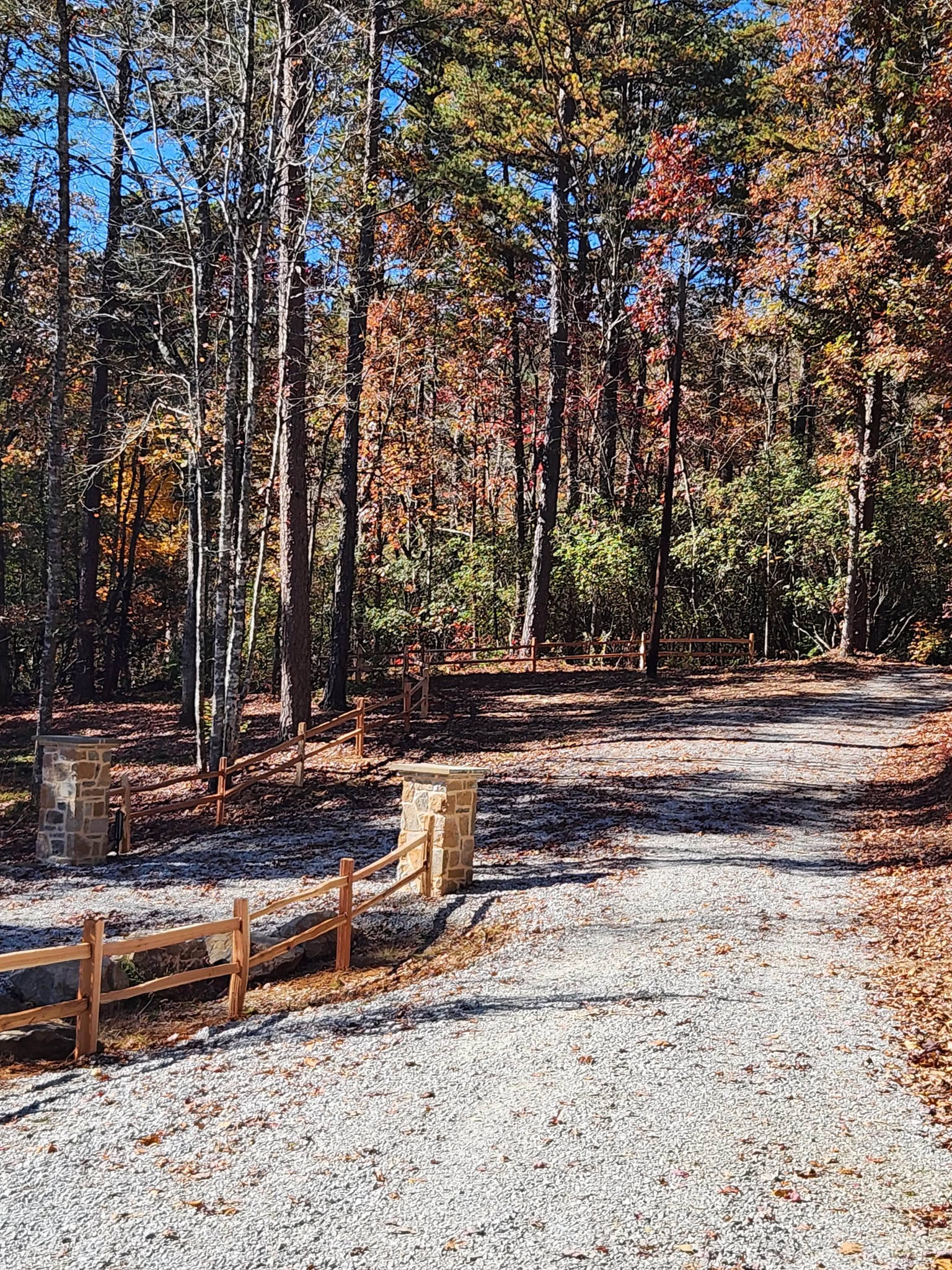 Split rail fence with stone column