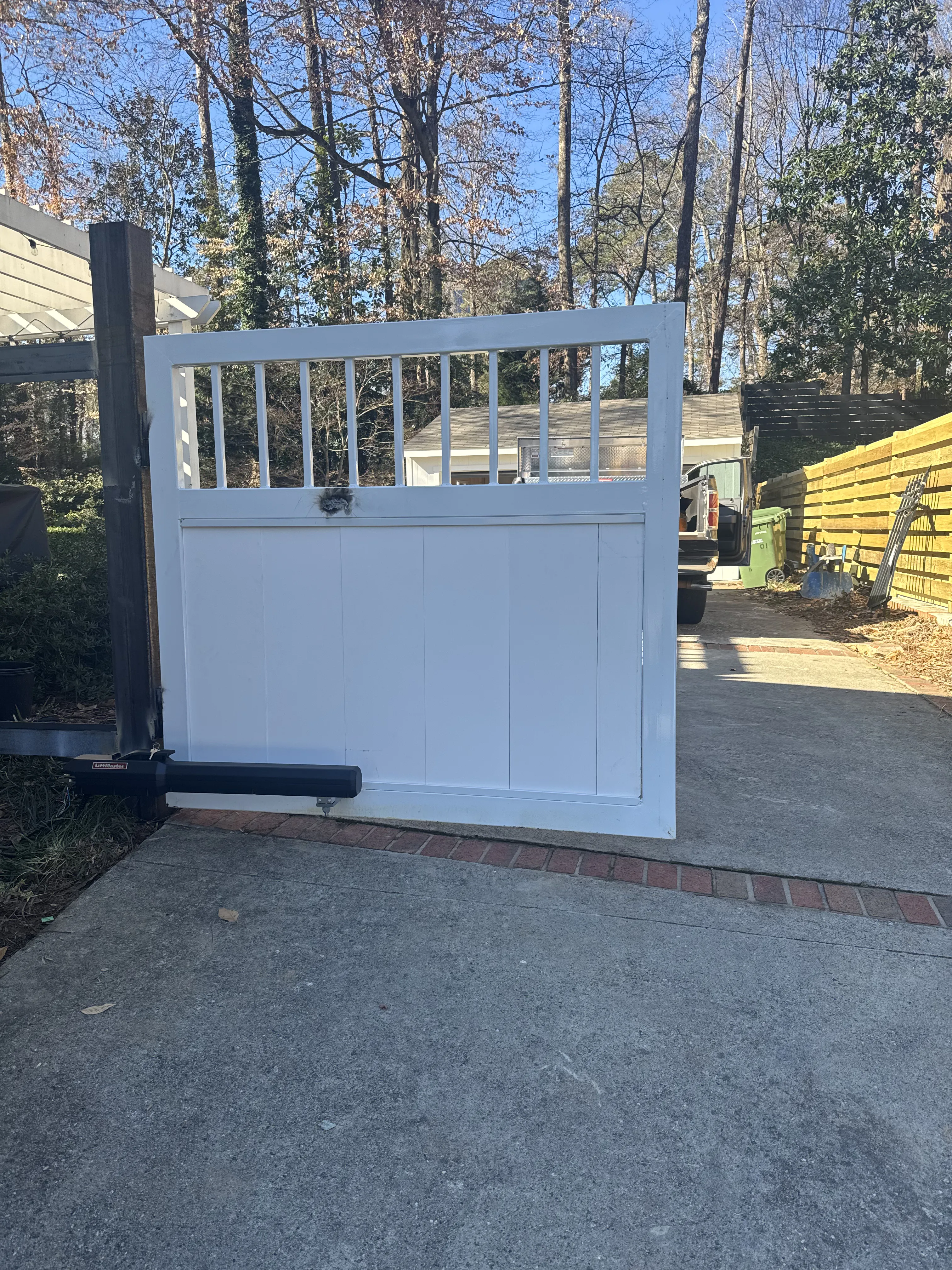 White vinyl gate with horizontal slat top