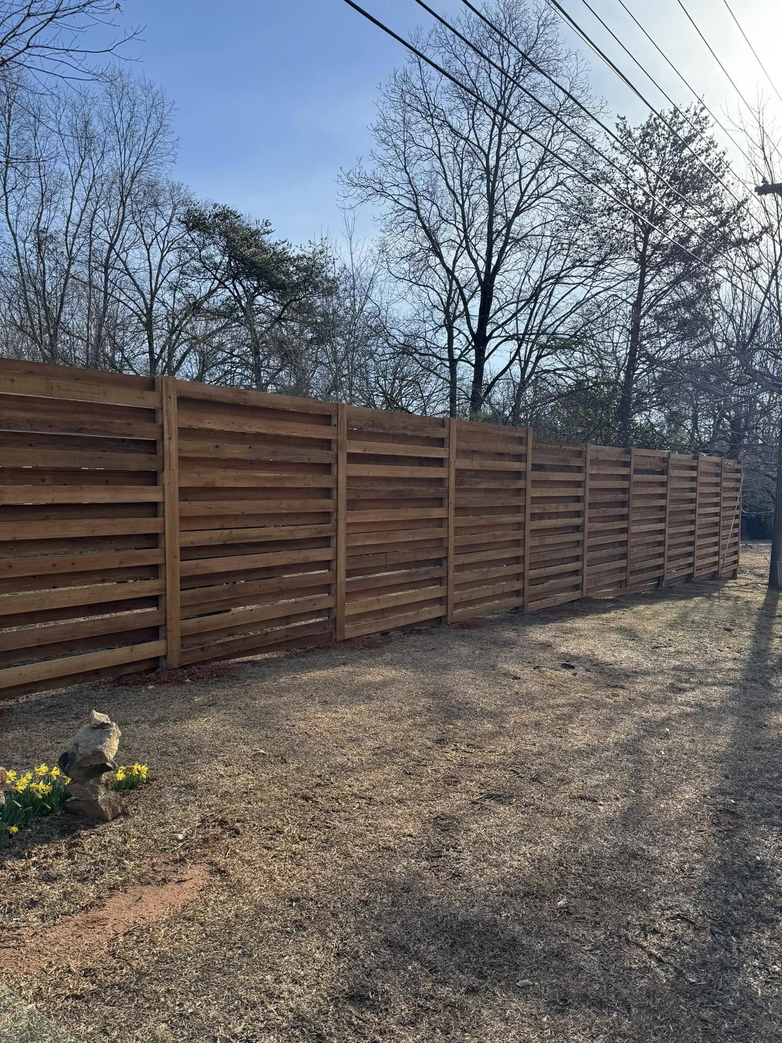 Stained cedar horizontal board fence