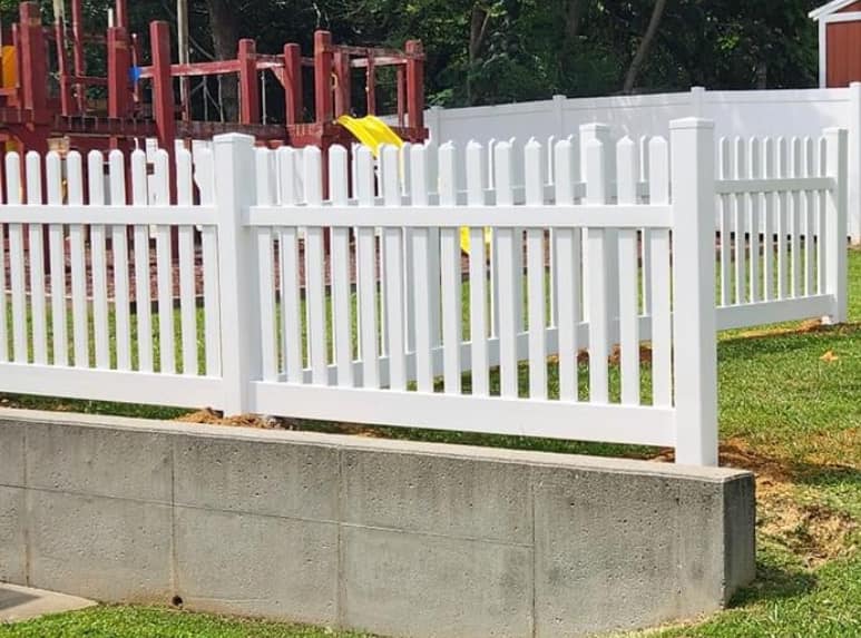White vinyl picket and privacy fence